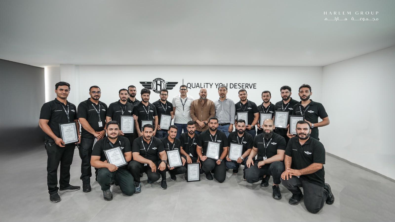 Harlem Group team receiving their training-program certificates
